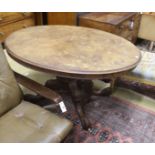 A Victorian oval figured walnut tilt top loo table, width 135cm, depth 100cm, height 72cm