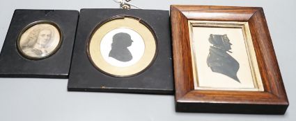 Two Victorian silhouette portraits and a printed monochrome portrait bust, all framed