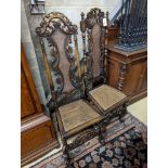 A pair of Carolean design carved beech high back chairs