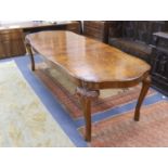 A Queen Anne revival burr walnut shaped oval extending dining table, 272cm extended, one spare leaf,