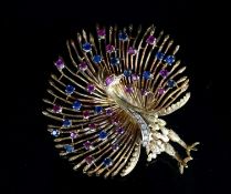 A modern 18k and multi gem set peacock brooch, 61mm, 29.7 grams gross,set with diamonds, rubies
