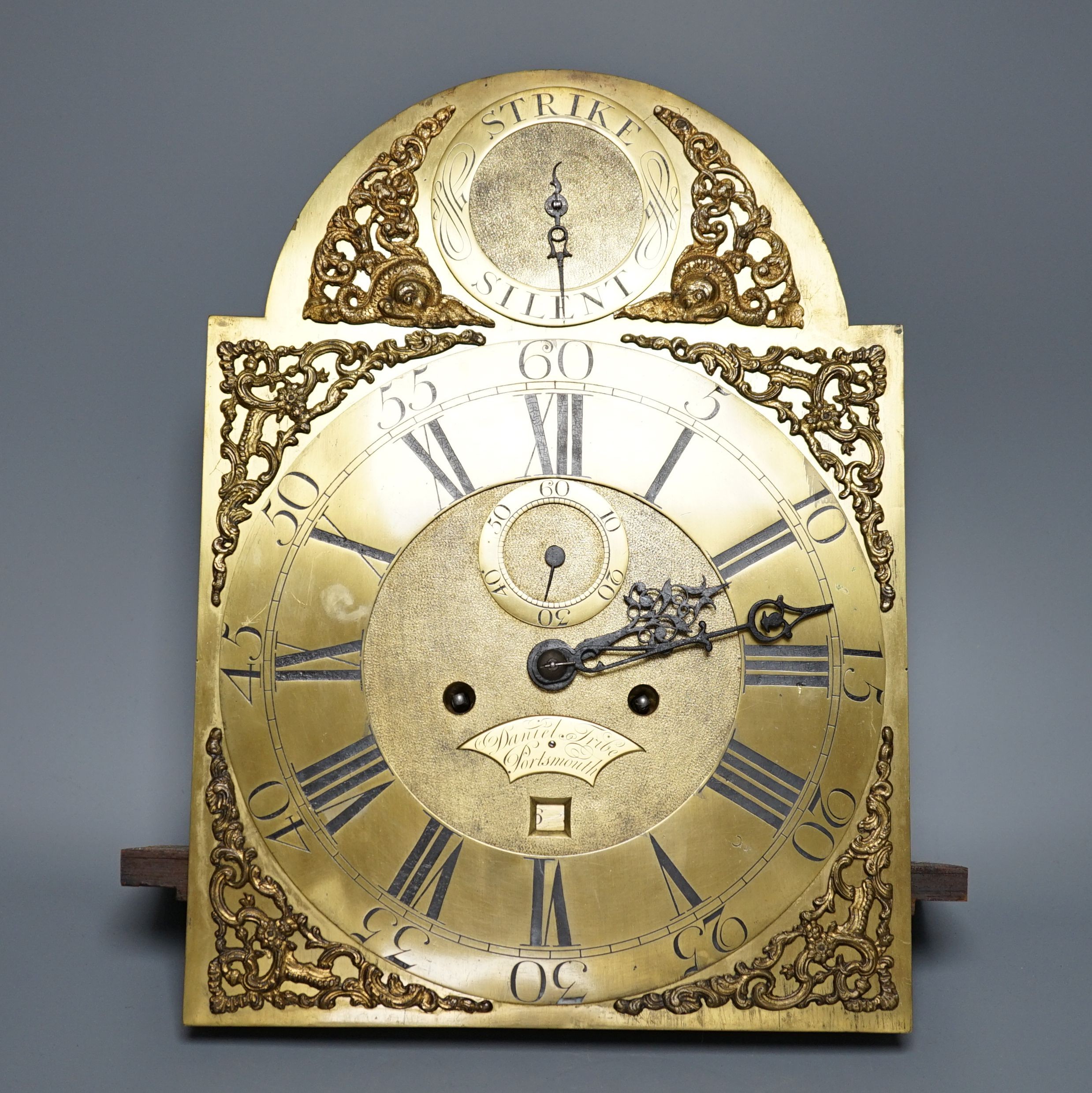 A George III 8-day arched brass dial and five pillar movement, signed Daniel Tribe, Portsmouth, no