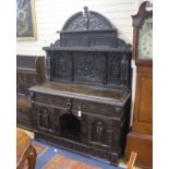 A late 19th century Flemish carved oak sideboard with raised panelled back, width 150, depth 60,