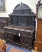 A late 19th century Flemish carved oak sideboard with raised panelled back, width 150, depth 60,