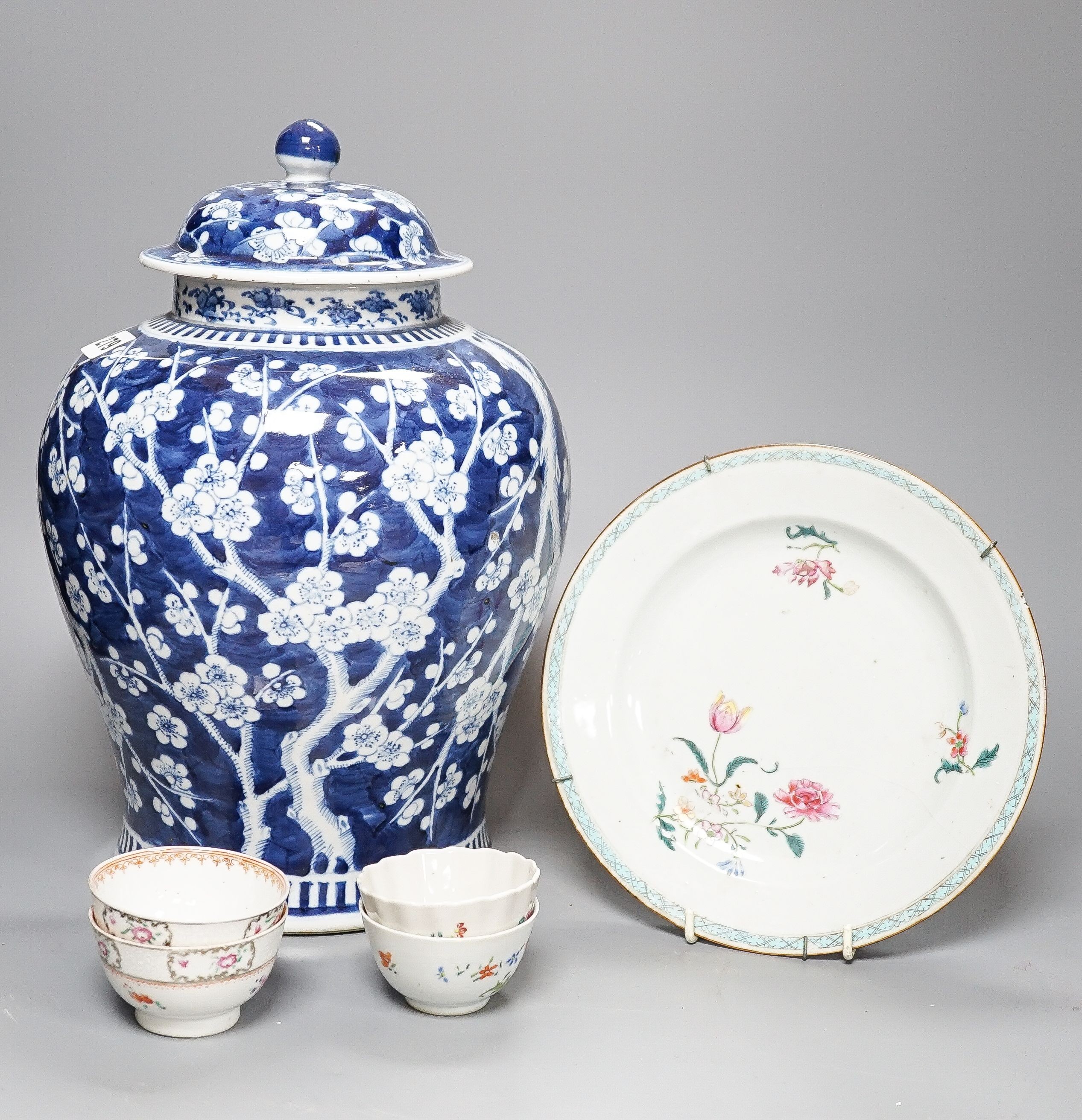 A 19th century Chinese blue and white Prunus jar and cover, 36cm and a group of 18th century Chinese