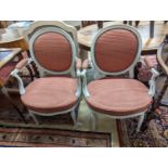 A pair of early 20th century French painted upholstered armchairs, width 59cm, depth 48cm, height