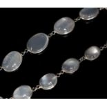 A modern white metal and graduated moonstone set spectacle necklace, 69cm.