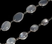 A modern white metal and graduated moonstone set spectacle necklace, 69cm.