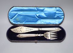 A cased pair of Victorian silver fish servers, Harrison Brothers, Sheffield, 1874, knife 31.5cm.