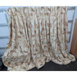 A pair of floral lined curtains. Approximate measurements: Width of top 230cm, Width of bottom 420cm