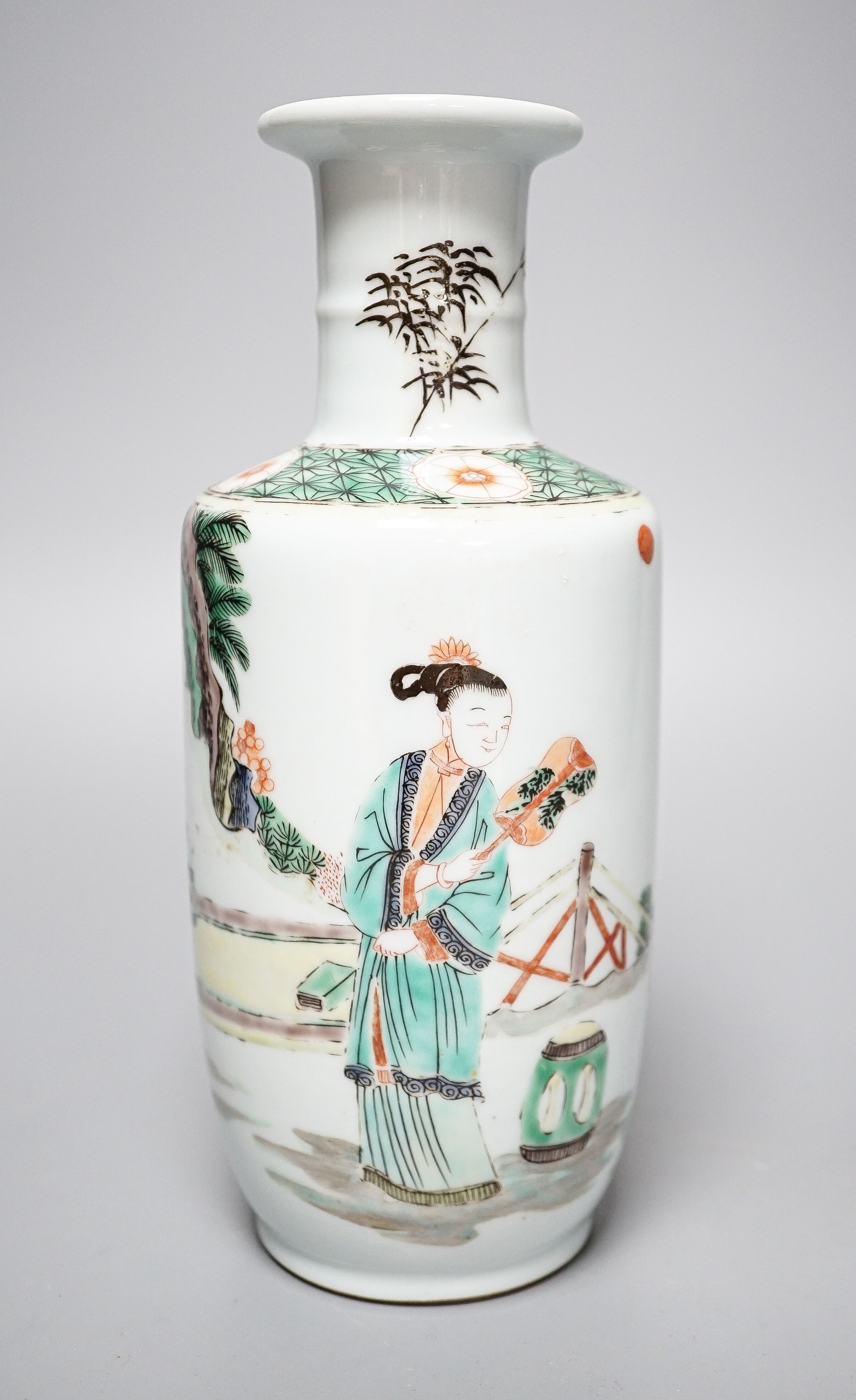 A Chinese famille verte rouleau vase, painted with figures in a garden, 22cm
