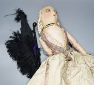 A boudoir doll circa 1920's and a black parasol