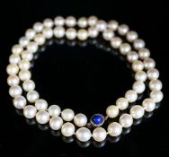 A single strand cultured pearl necklace, with yellow metal, lapis lazuli and diamond set clasp,