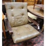 A mid century swivel chair with leather cushion upholstery, width 77cm, depth 75cm, height 94cm