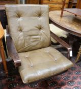 A mid century swivel chair with leather cushion upholstery, width 77cm, depth 75cm, height 94cm