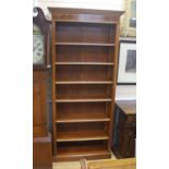A reproduction satinwood banded yew open bookcase, length 92cm, depth 36cm, height 210cm