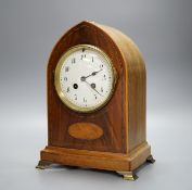 An Edwardian mahogany mantel clock, lancet top case, with white enamelled dial. Key and pendulum.