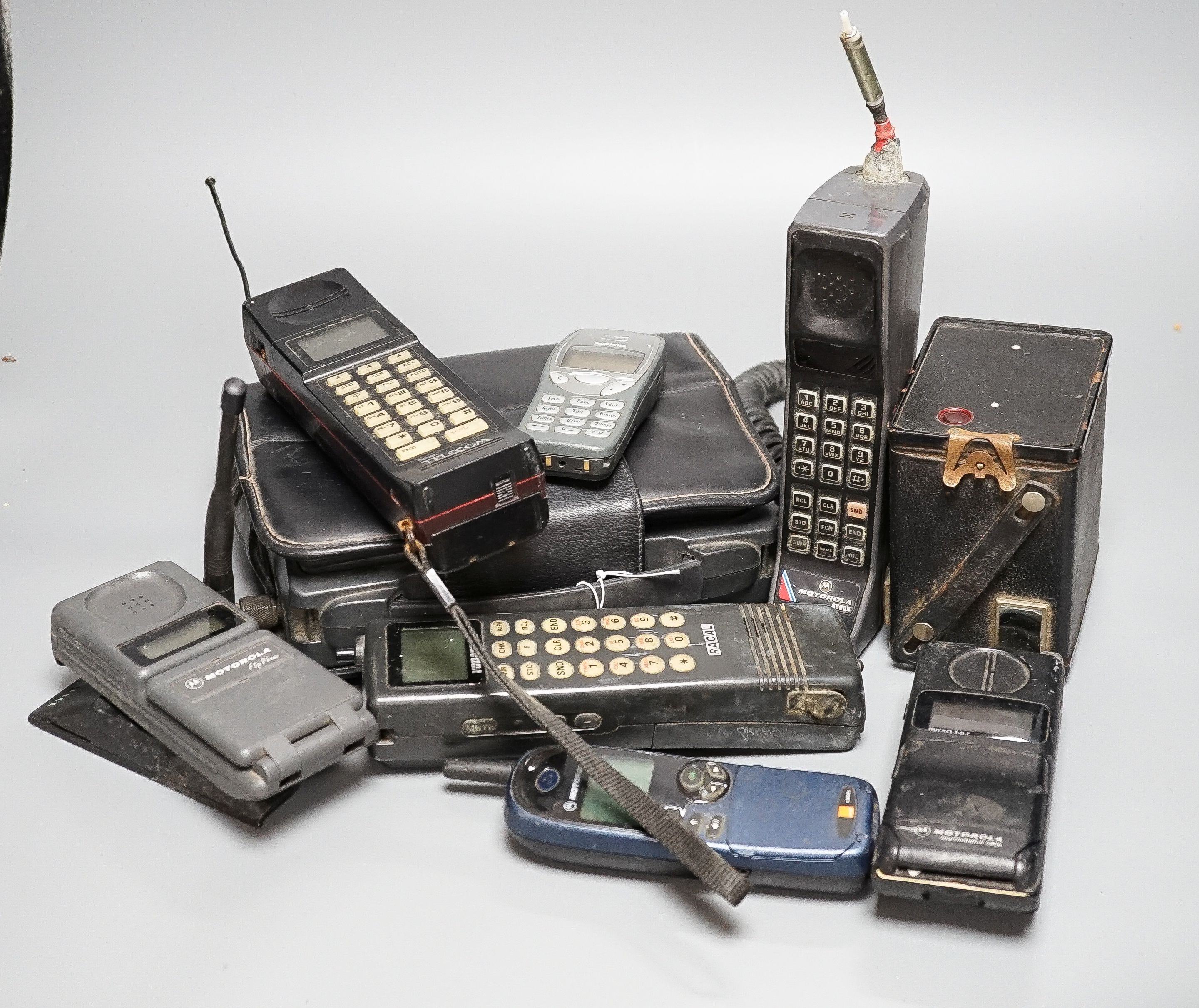 Eight early/retro mobile phones and a Box Brownie