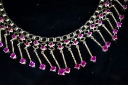 A modern yellow metal (stamped 18) and synthetic ruby? set drop fringe necklace, 41cm, gross 35