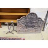 A heavy cast iron fire back, length 79cm, height 67cm together with a pair of fire dogs (3)