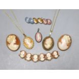 A modern 9ct gold and oval cameo shell bracelet, 16cm, two 9ct mounted cameo shell brooches, a