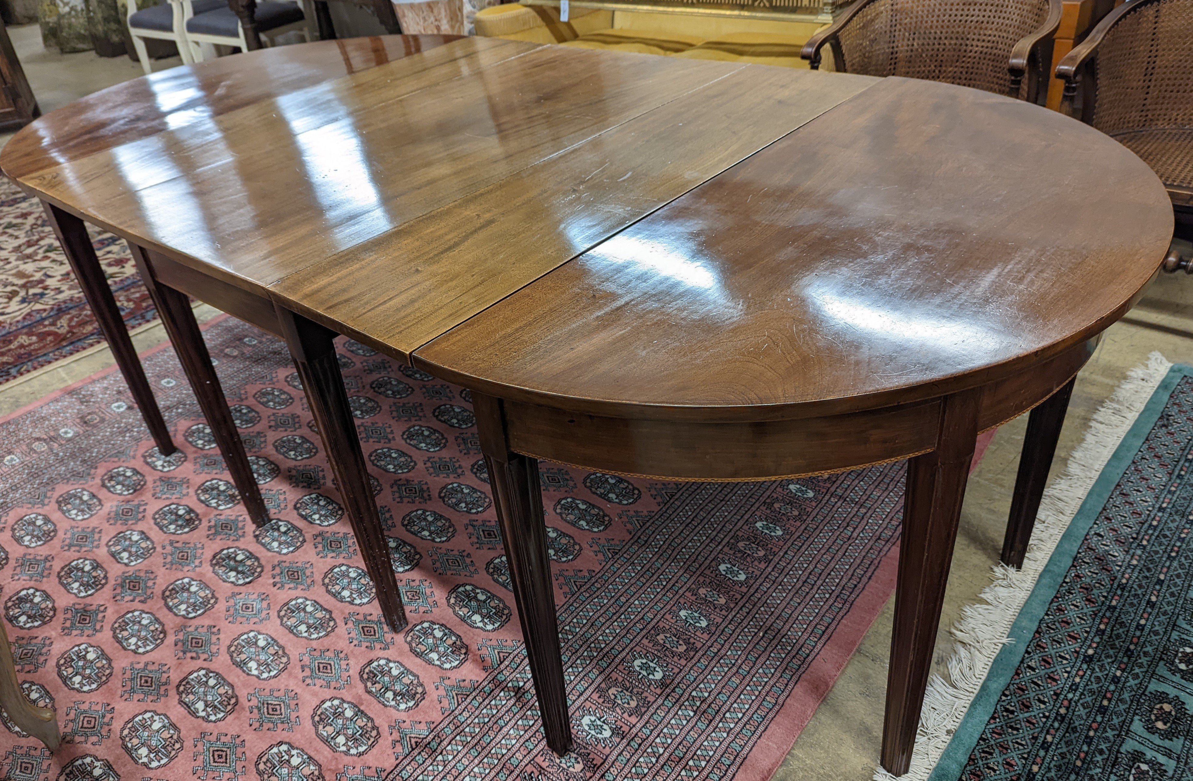 A George III mahogany D end extending dining table, with drop flap central section, length 240cm