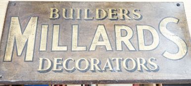 A painted wood advertising sign ‘MILLARDS BUILDERS DECORATORS’, pre war 33x67cm