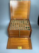 A coin and medal collection in a Victorian mahogany 12 coin tray collector's case, 30 x 26 x
