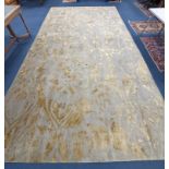 A contemporary 'Son' Nepalese wool and silk stone grey and gold carpet, 490 x 270cm