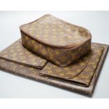 Five Pieces of Louis Vuitton to including a toilet bag, and two soft cases.