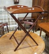 A Victorian brass mounted mahogany folding butler's tray on stand, width 69cm, depth 49cm, height