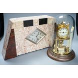 An Art Deco rouge marble mantel timepiece, 45cm wide, quartz movement replacement and a brass