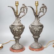 A pair of early 20th century spelter ewers mounted as lamps 42cm