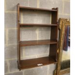 A mahogany three shelf wall bracket, width 57cm, depth 23cm, height 94cm