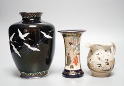 A Japanese black ground ‘cranes’ cloisonné enamel vase, 18.3cm, a Satsuma pottery vase and a crane