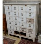 An early 20th century painted beech filing cabinet (lacking two drawers), width 114cm, depth 52cm,
