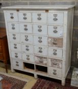 An early 20th century painted beech filing cabinet (lacking two drawers), width 114cm, depth 52cm,