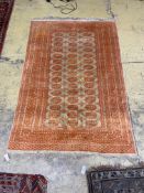 A Bokhara ivory ground rug, 190 x 130cm