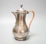 An Edwardian silver baluster hot water jug, George Perkins, London, 1909, height 22.9cm, gross 19.