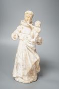 A 19th century carved alabaster group, friar with child 28cm