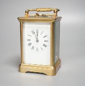 A brass repeating carriage clock, 13cm with key