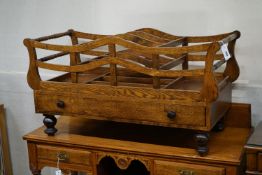 A large reproduction Victorian style oak Canterbury, width 107cm, depth 46cm, height 55cm