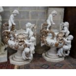 A pair of composition faux marble cherub and mask jardinieres, height 112cm