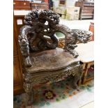 A Chinese carved hardwood 'dragon' elbow chair, width 68cm, depth 47cm, height 88cm