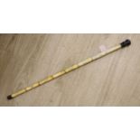 An engraved bone walking cane, 84cm