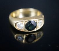 An 18ct gypsy set sapphire and diamond three stone ring, size U, gross 11.8 grams,(one of the