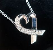 A modern Paloma Picasso for Tiffany & Co 750 white metal and diamond set loving heart pendant