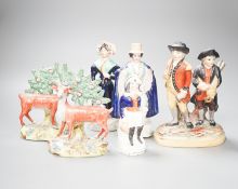 A group of Staffordshire figures, including a pair of deer standing before bocage, 15cm, a Victorian