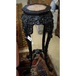 A Chinese carved hardwood marble top octagonal vase stand, width 40cm, height 90cm