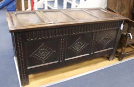 An 18th century panelled oak coffer, length 136cm, depth 57cm, height 66cm